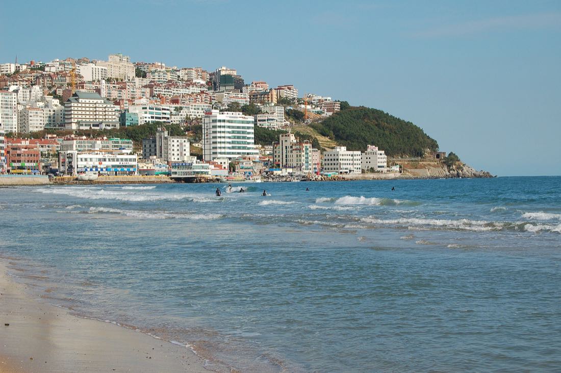 Haeundae Beach with the towers of the district rising behind the sand