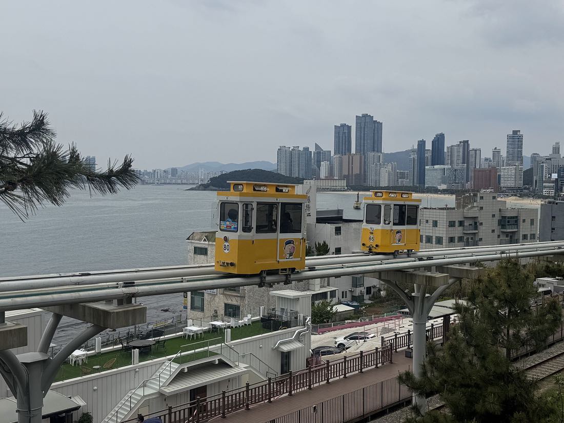 A Sky Capsule car on the elevated Blueline Park track at Haeundae